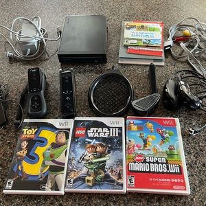 Nintendo Wii. Includes Super Mario Bros/Star Wars III/Toy Story and accessories!